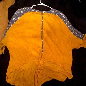 Yellow loose top with florals.